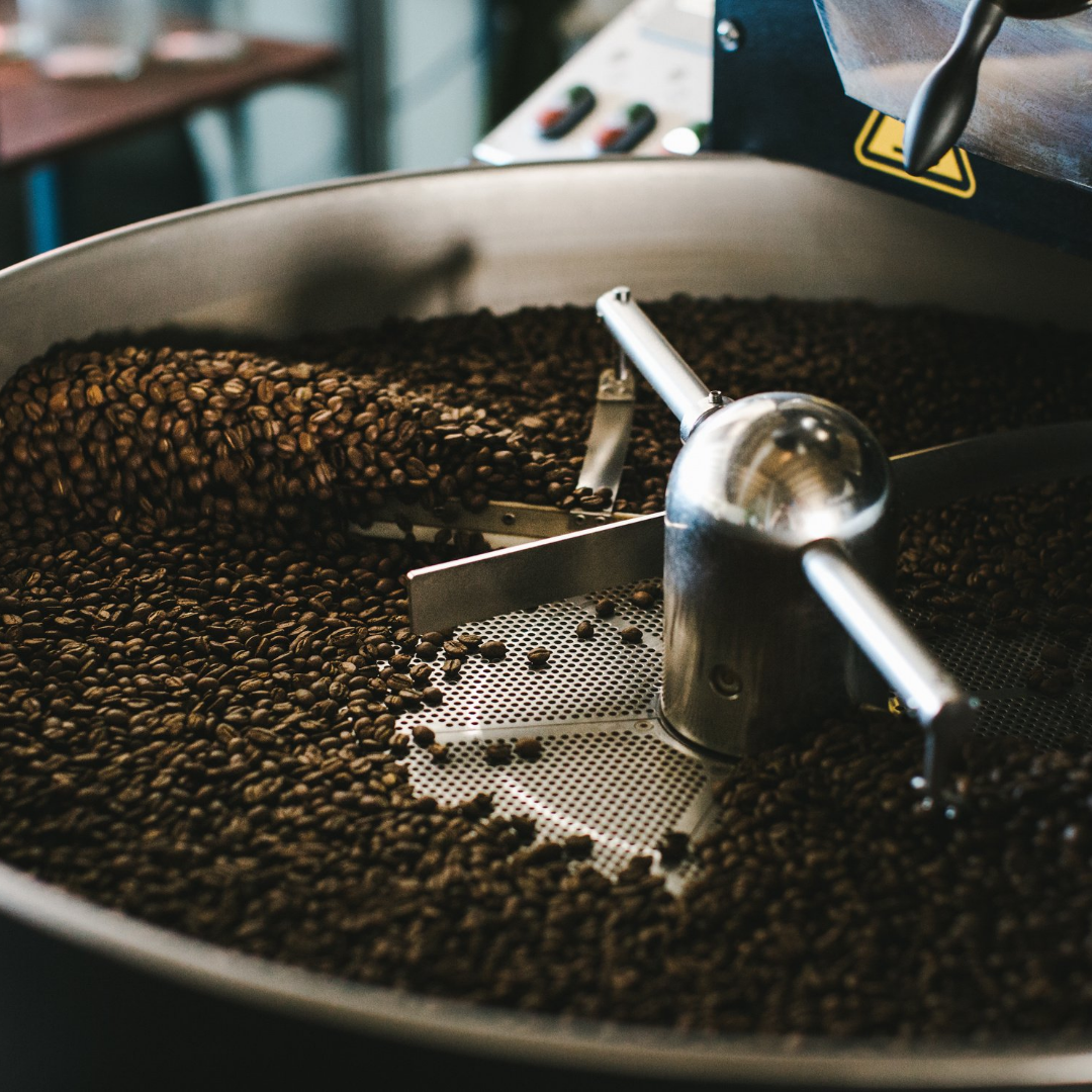 Grouch and Co coffee being roasted in a 12kg Probat coffee roaster which is black and silver